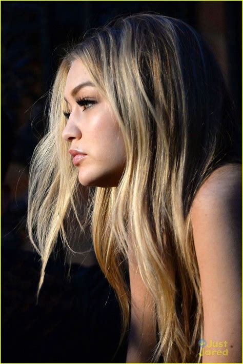 for the muse gigi hadid with effortless wavy hair subtle smokes eyes and nude make up