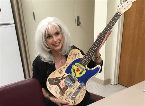 heavily autographed guitar sold in honor of ex replacement slim dunlap