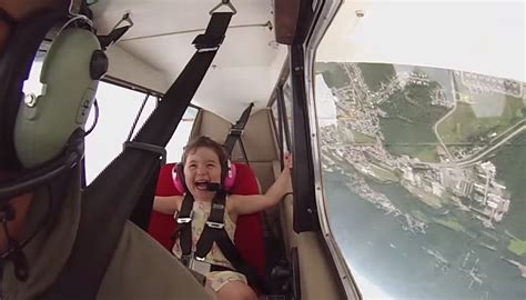 girl laughs a lot on first aerobatic plane ride with dad video time