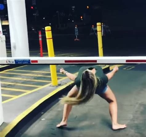 drunk girl tries to limbo with parking garage gate daily mail online