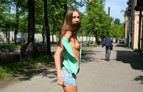 skinny girl with big pussy walking around the city in a mini skirt without panties russian