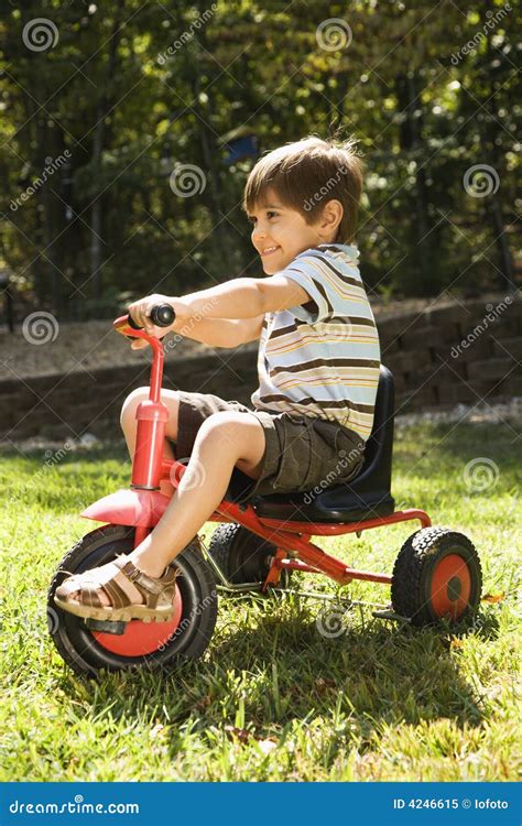 boy riding tricycle stock image image  hispanic color
