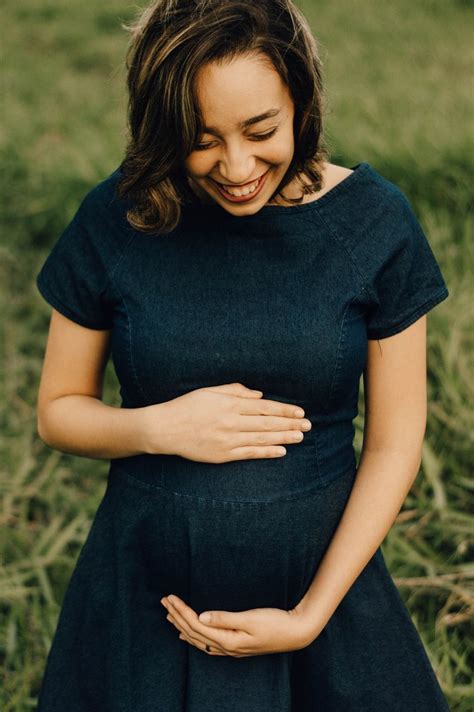 smiling woman wearing black dress  daytime photo  apparel