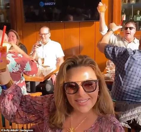 kelly dodd raises glass to super spreaders while drinking at crowded