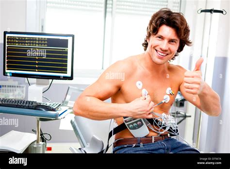 portable heart monitor man wearing  portable electrocardiograph