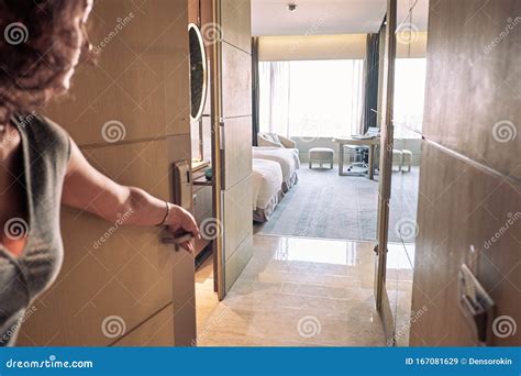 woman opening  door  hotel room stock image image  closeup