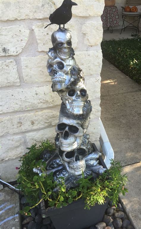 dollar tree skulls  great stuff foam halloween topiary