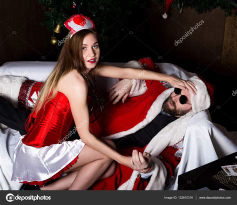 Drunk Santa Claus Lying On Sofa Female Nurse Sexy Woman In Carnival