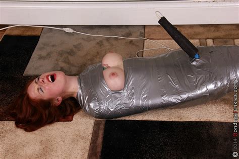 redhead bondage girl in duct tape on the floor 14632