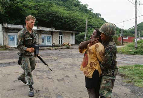 american soldiers capture  local man    invasion   island  grenada october
