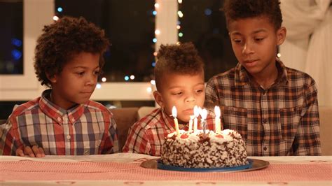 kids blowing cakes candles  black boys stock footage sbv
