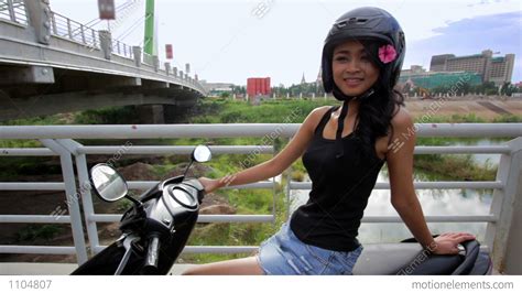 gorgeous asian girl with motorcycle stock video footage 1104807