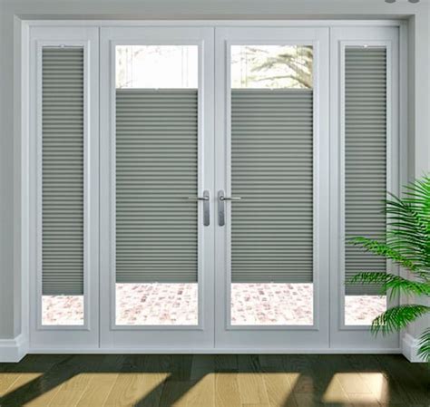 white room  sliding glass doors  blinds   windows  front   potted plant