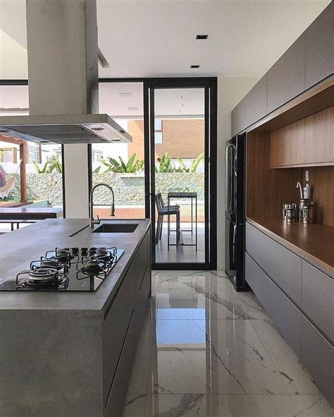 jonas manfrin  instagram cozinha em conceito aberto  porcelanato marmorizado   ilha