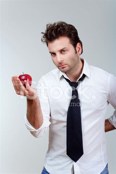 man holding red apple stock photo royalty  freeimages