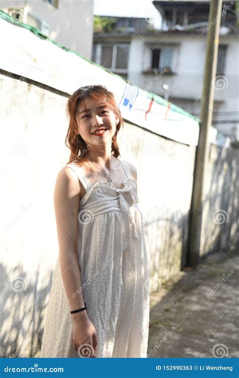 Beautiful And Lovely Asian Girl Shows Her Youth In The Park Stock Image