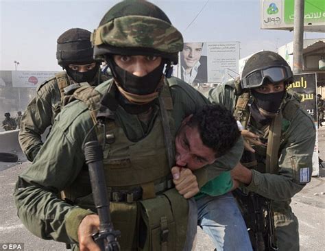 Palestinian Protester Dragged Away By Israeli Soldiers In Clashes Over