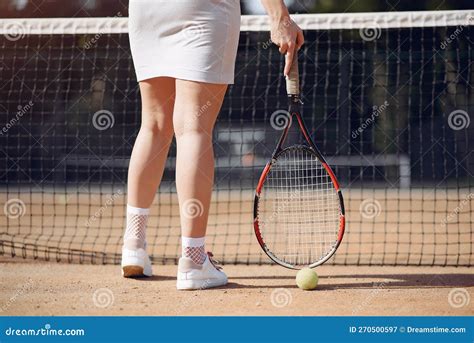 Cropped Photo Of Legs Of Female Tennis Player Who Holding A Racket
