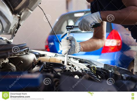 mechanic working  auto repair garage car maintenance stock photo