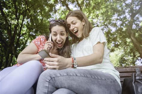 Girlfriends Taking Selfie Together Having Fun Outdoors