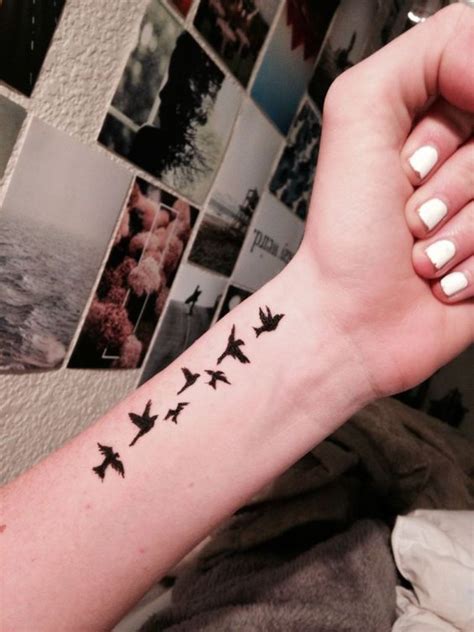 elegant birds wrist tattoos design