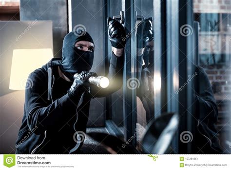 masked burglar breaking into the house stock image image of dangerous
