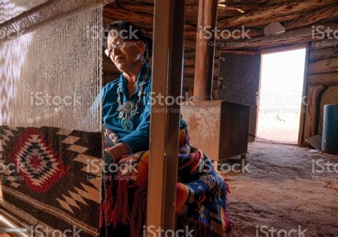 elderly native american navajo woman weaving a traditional tribal