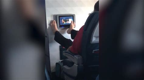 video of airline passenger using screen with bare feet goes viral cnn