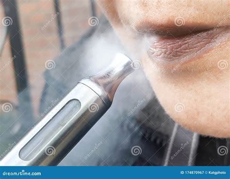 Woman With Vaping E Cigarette Blowing Vape Cloud Closeup Stock Image