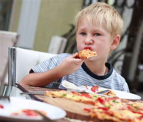 boy eating pizza growing  baby
