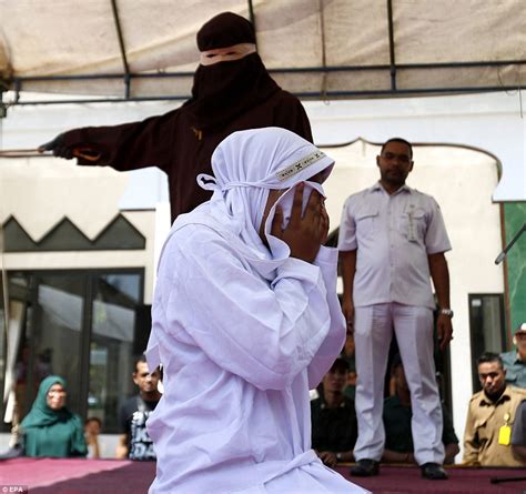 indonesian woman is forced to endure 26 lashes daily mail online