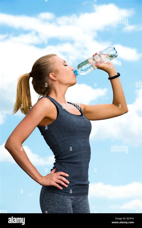 Fitness Beautiful Blonde Woman Drinking Water After Sports On The