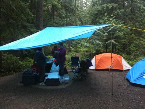 camp tarp camping   rain bring  tarp  lots