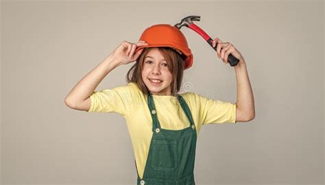 Examining Renovation And Repair Using Working Tool Teen Girl In