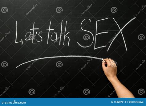 woman writing phrase `let`s talk sex` on blackboard stock image image