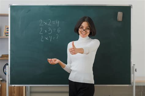 Free Photo Smiling Showing Thumbs Up Young Female Teacher Wearing