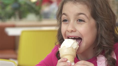 happy  happy  girl eating ice cream   cafe stock video