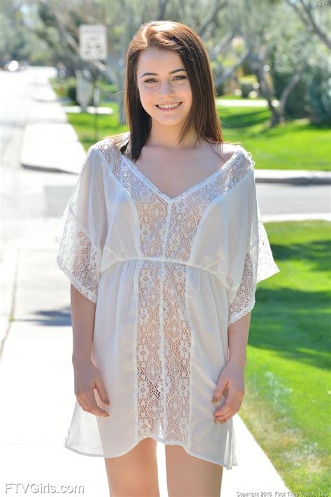 cute amateur in a sheer white dress
