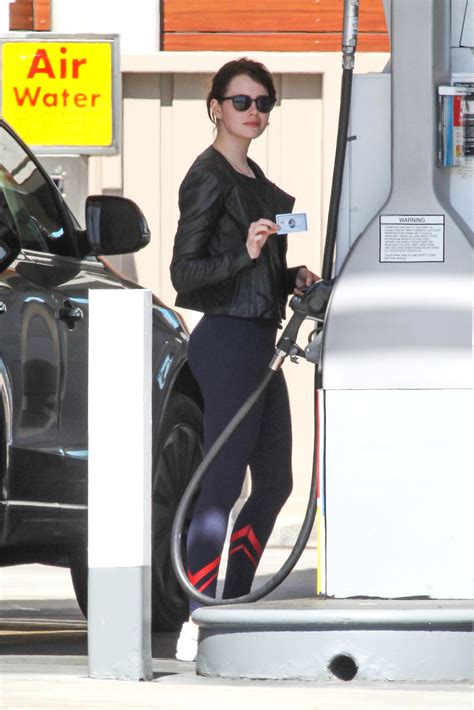 emma stone perfect buns in spandex at a gas station in