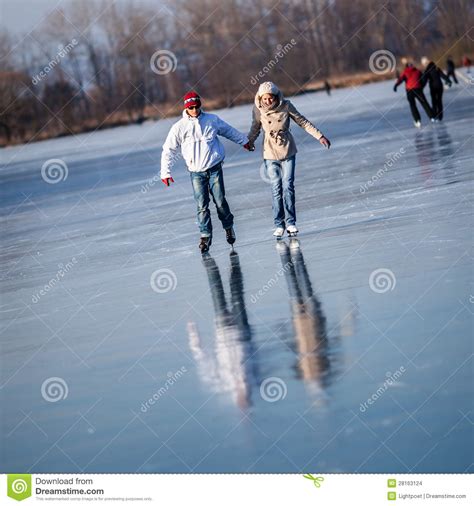 Couple Ice Skating Outdoors On A Pond Stock Images Image