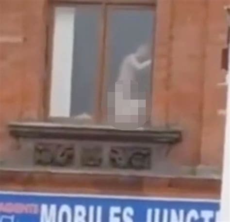 naked couple spotted romping through flat window above busy city centre street mirror online