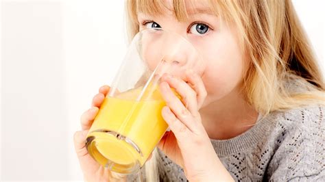 parents  children drink fruit juice coach