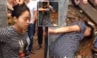 pregnant chinese woman is tied to a pole and beaten for allegedly being