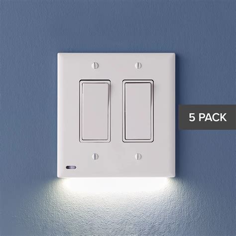 white light switch sitting  top   wall    blue wall   words  pack