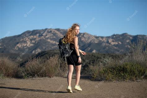 premium photo backpacking tourism concept woman hiker with backpack
