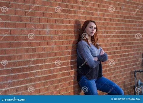 A Lovely Redhead Model Enjoys An Spring Day Outdoors Stock Image