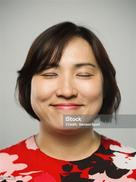 portrait of real chinese mature woman with happy expression and eyes