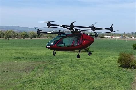 autonomous passenger drone swoops   flying taxi scene