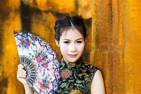 Chinese Girl In Traditional Chinese Cheongsam Blessing Stock Image