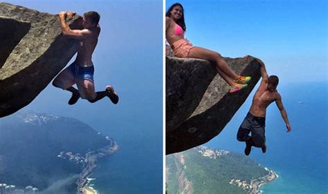 crazy couple hang 3000ft off cliff in rio de janeiro travel news